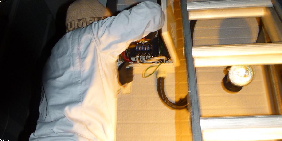 Electrician working on panel